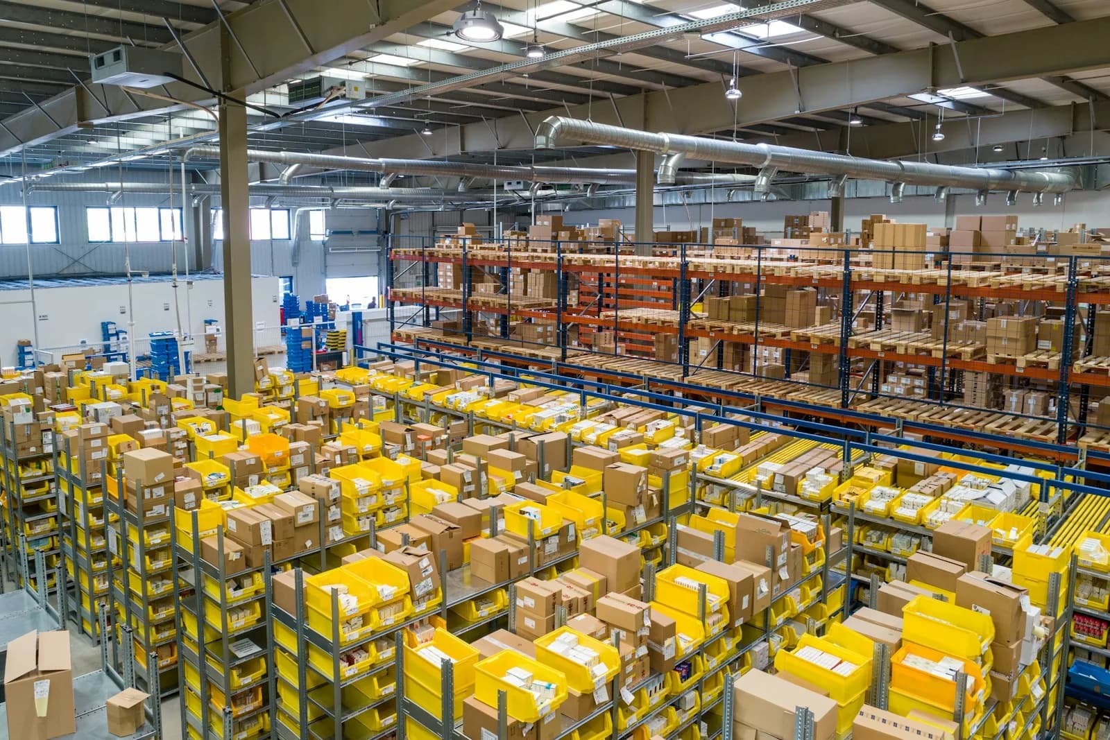 High-bay warehouse aisles served by forklift operations